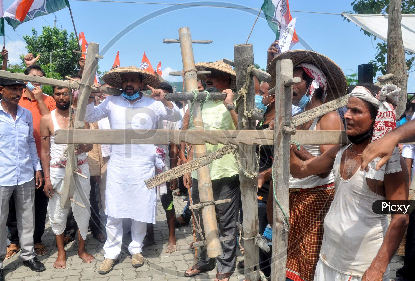 Activists of Congress staging a protest demonstration at Chachal protest ground, against the Agricultural reform bill 2020, in Guwahati on Monday.