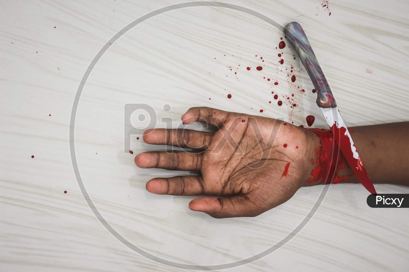 Committed Suicide Concept - Man Suicide By Knife Cutting A Wrist, Depressed Man, Sad Love, Low Self Esteem, The Knife Hand And A Lot Of Blood. To Cut My Veins On The Hand With A Kitchen Knife.