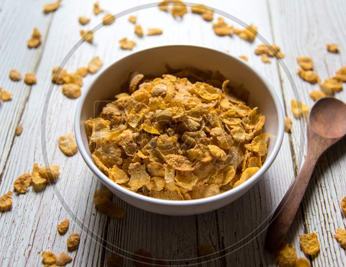 Close up of corn flakes in a bowl on a background