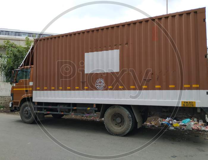 Closeup Of Closed Long Container Or Truck Parking On Road Side