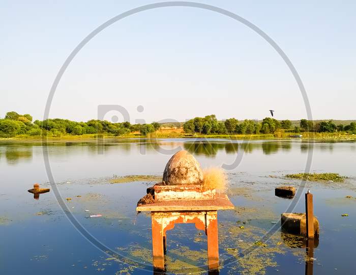 Small Old Stone Dome In River Water