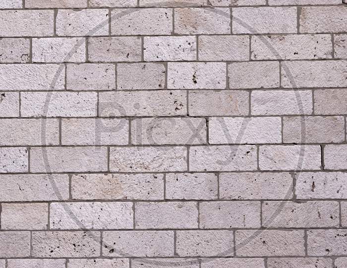 A Grey Bricked Rectangular Wall