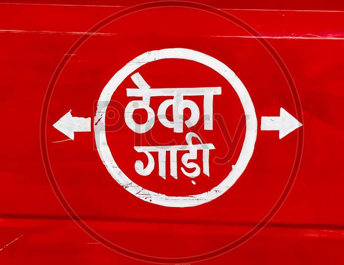 Transport For Hire, Text Written In Hindi Language On A Red Background On A Transport Vehicle.