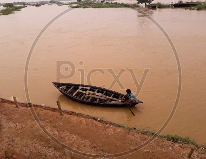 A small boat in the flooded area.