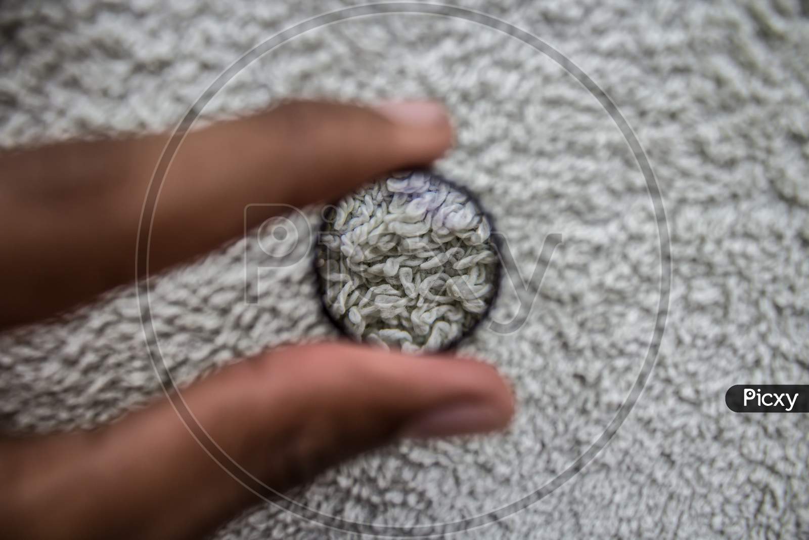 Selective Focus Of Magnifying Glass Showing Detail On Fabric