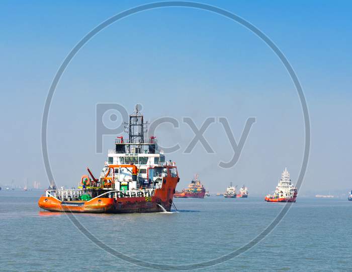 Beautiful Orange Boat Standing In The Middle Of The Ocean With Blue Sky