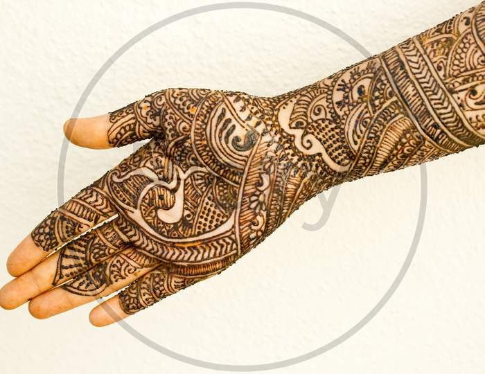 Beautiful Artwork Drawn On The Hand With Mehndi.