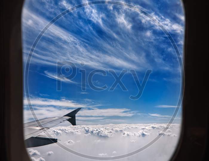 Beautiful Aerial View Of Sky From The Plane Of Window.