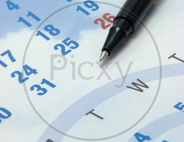 Closeup Of A Calendar & Pen