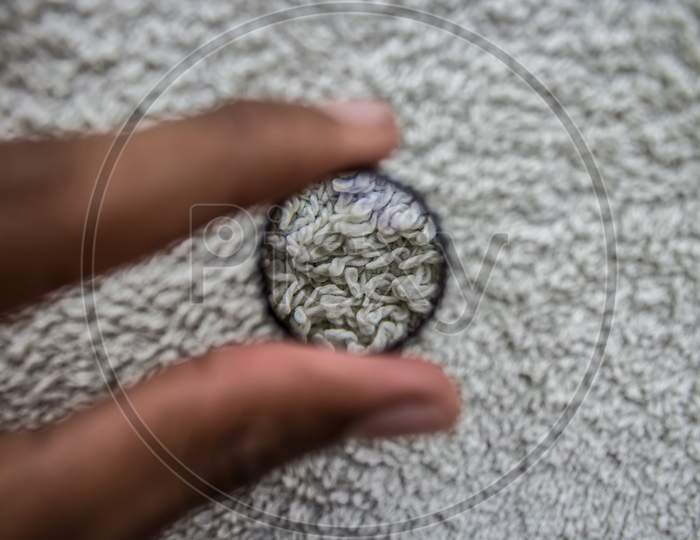 Selective Focus Of Magnifying Glass Showing Detail On Fabric