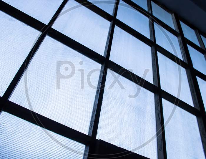 Selective Focus Abstract Low Angle View Of Warehouse Windows