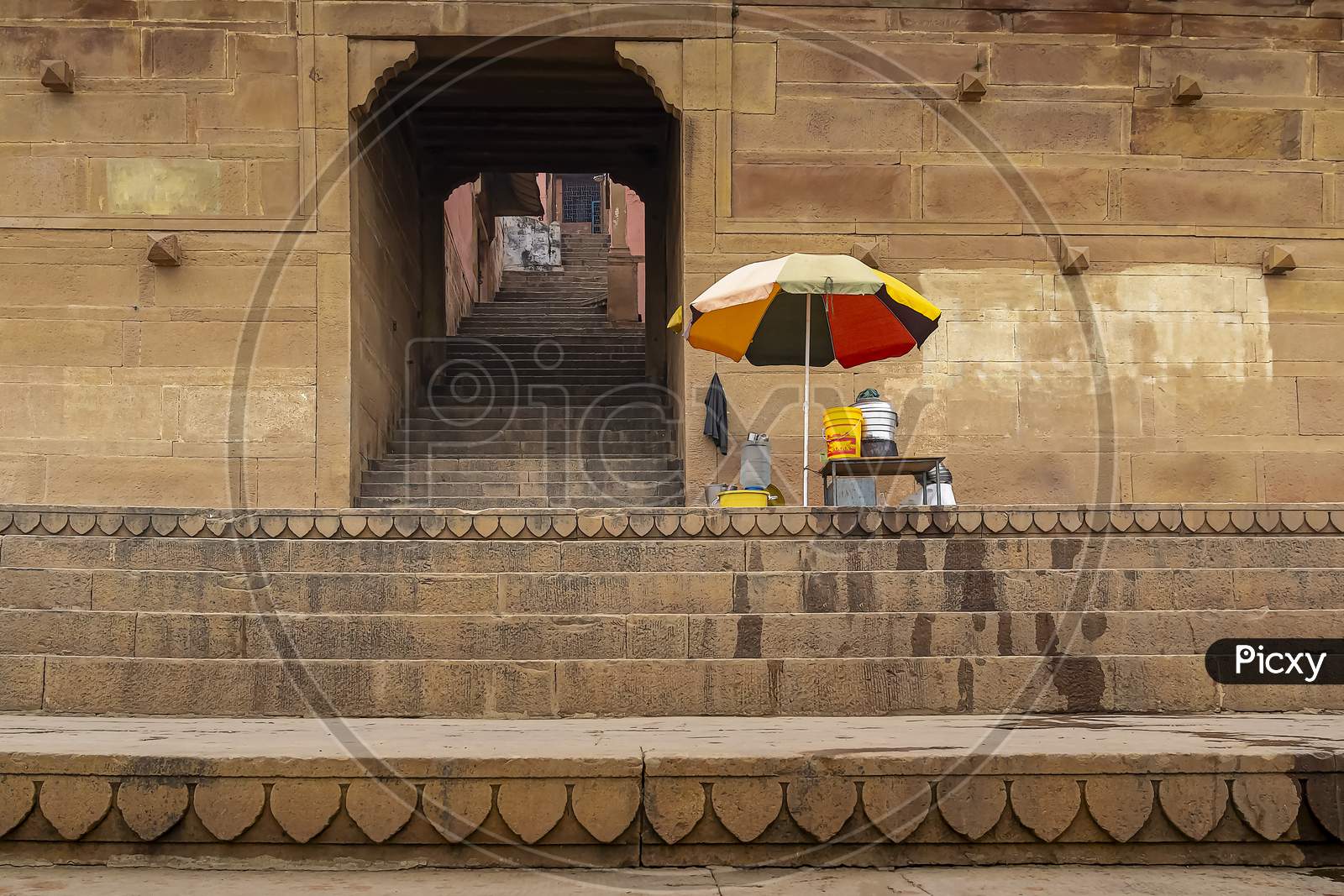 A food trader at a temple entrance on the banks of the holy River Ganges.