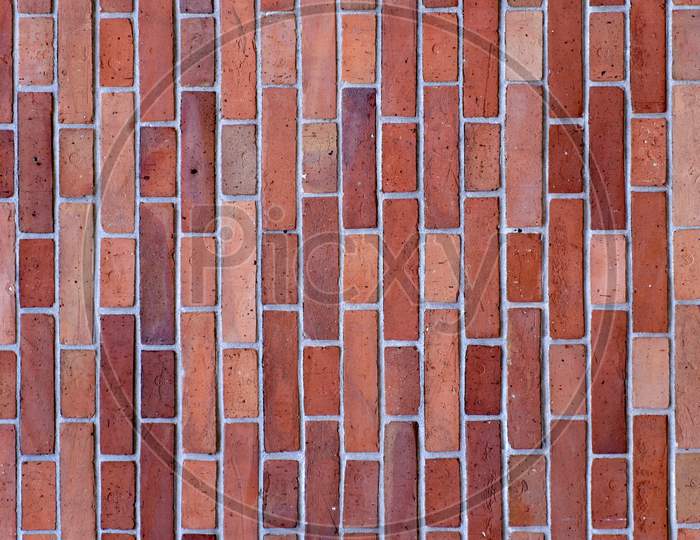 Wall Made Up Of Red Bricks Looking Stunning In Rectangular Pattern