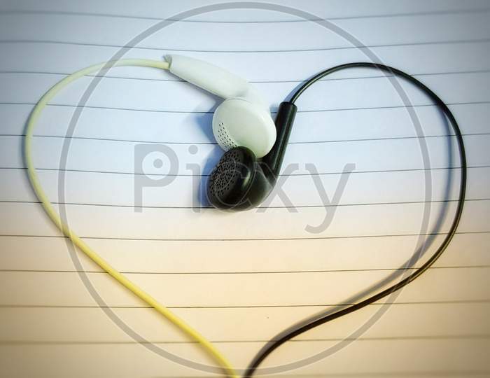 Heart made by using earphones.
