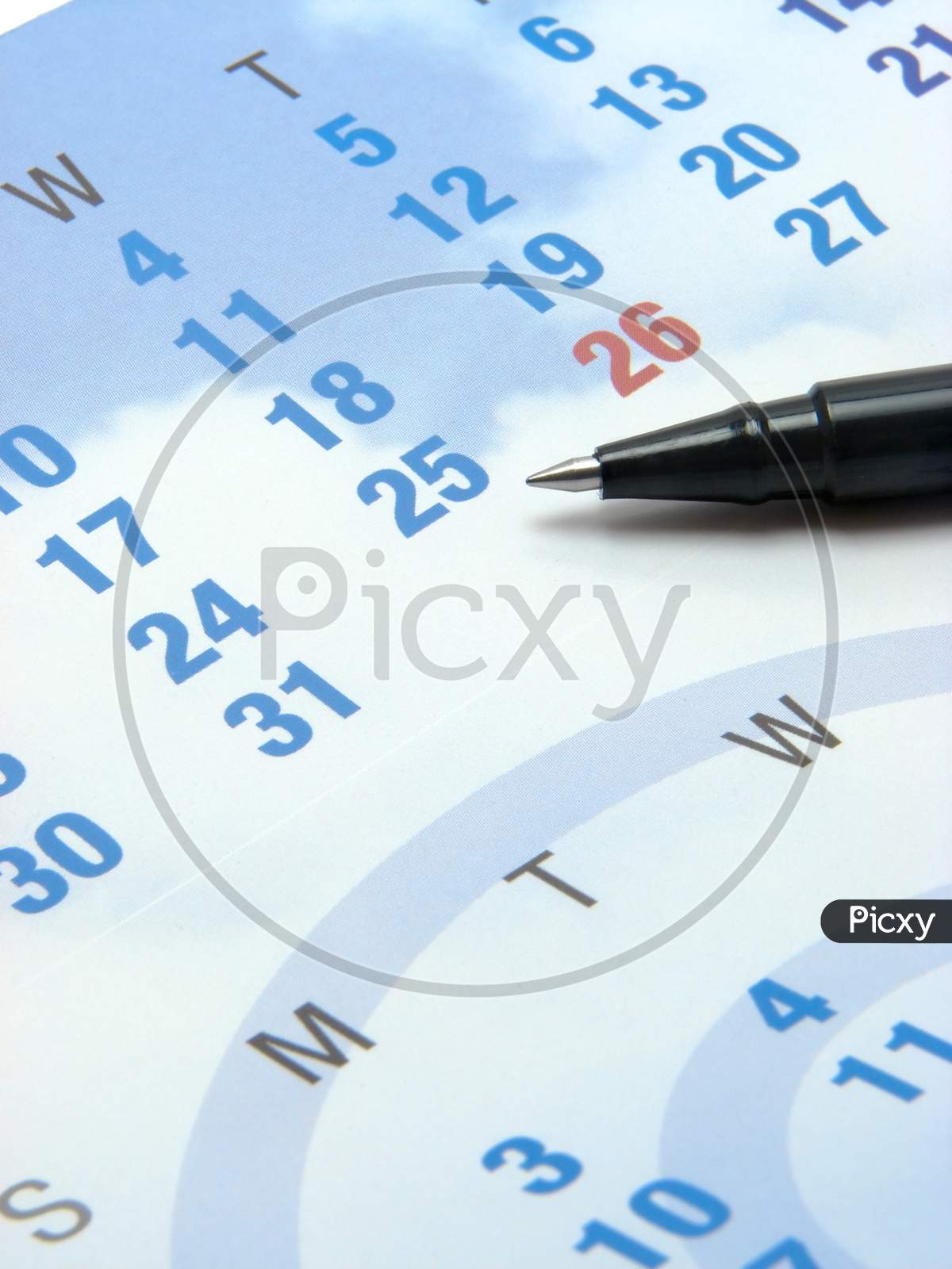 Closeup Of A Calendar & Pen