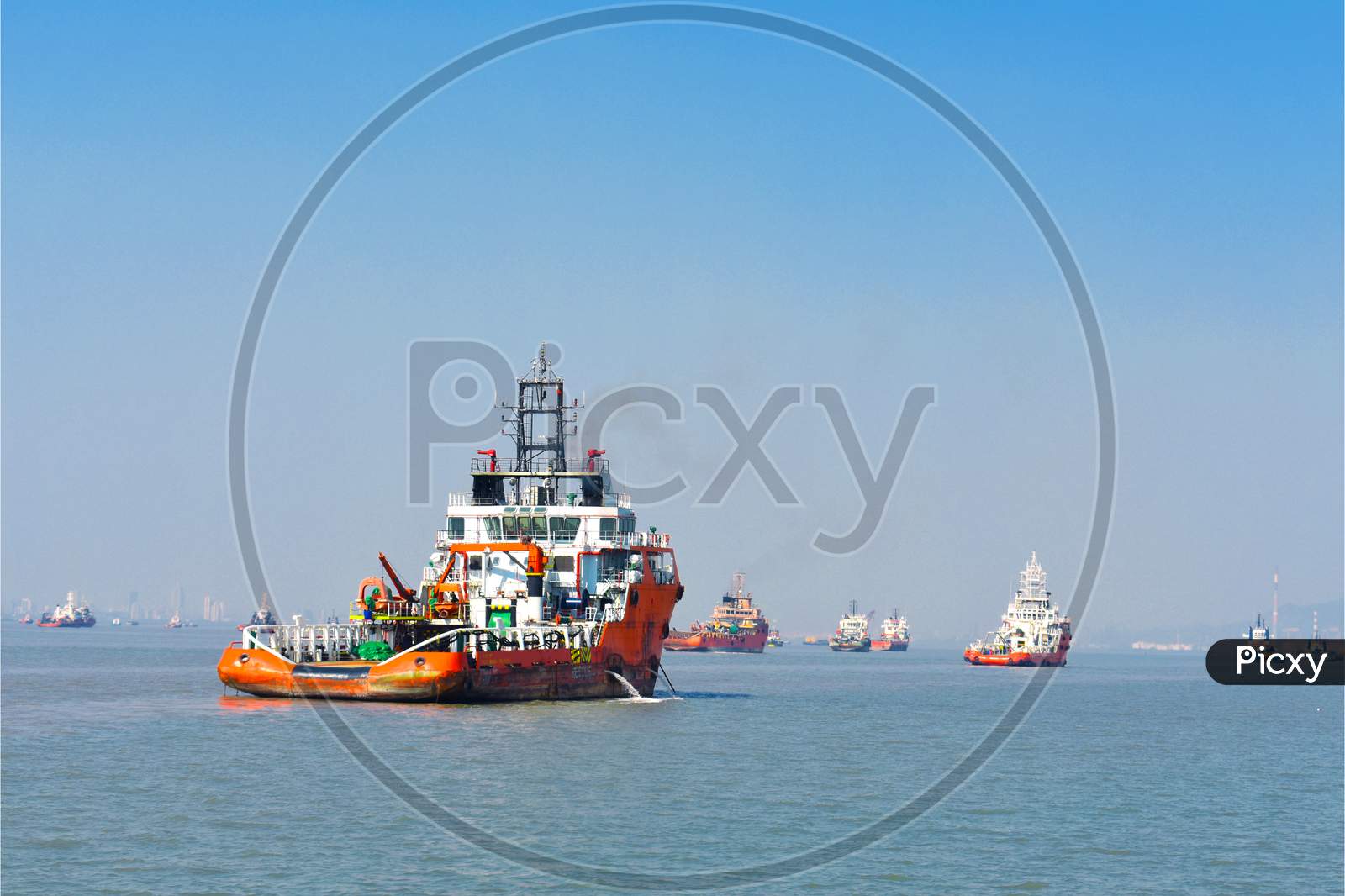 Beautiful Orange Boat Standing In The Middle Of The Ocean With Blue Sky
