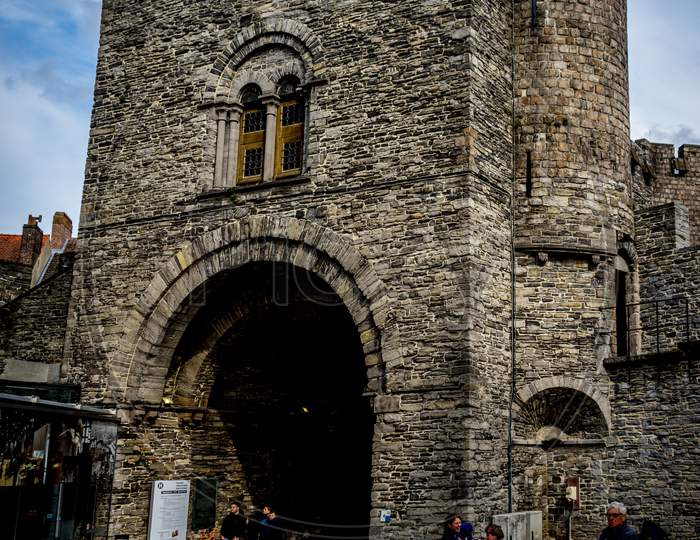 Ghent Belgium - April 15 : Toursists Enter The Arch Of The Gravensteen Castle In Ghent, Belgium