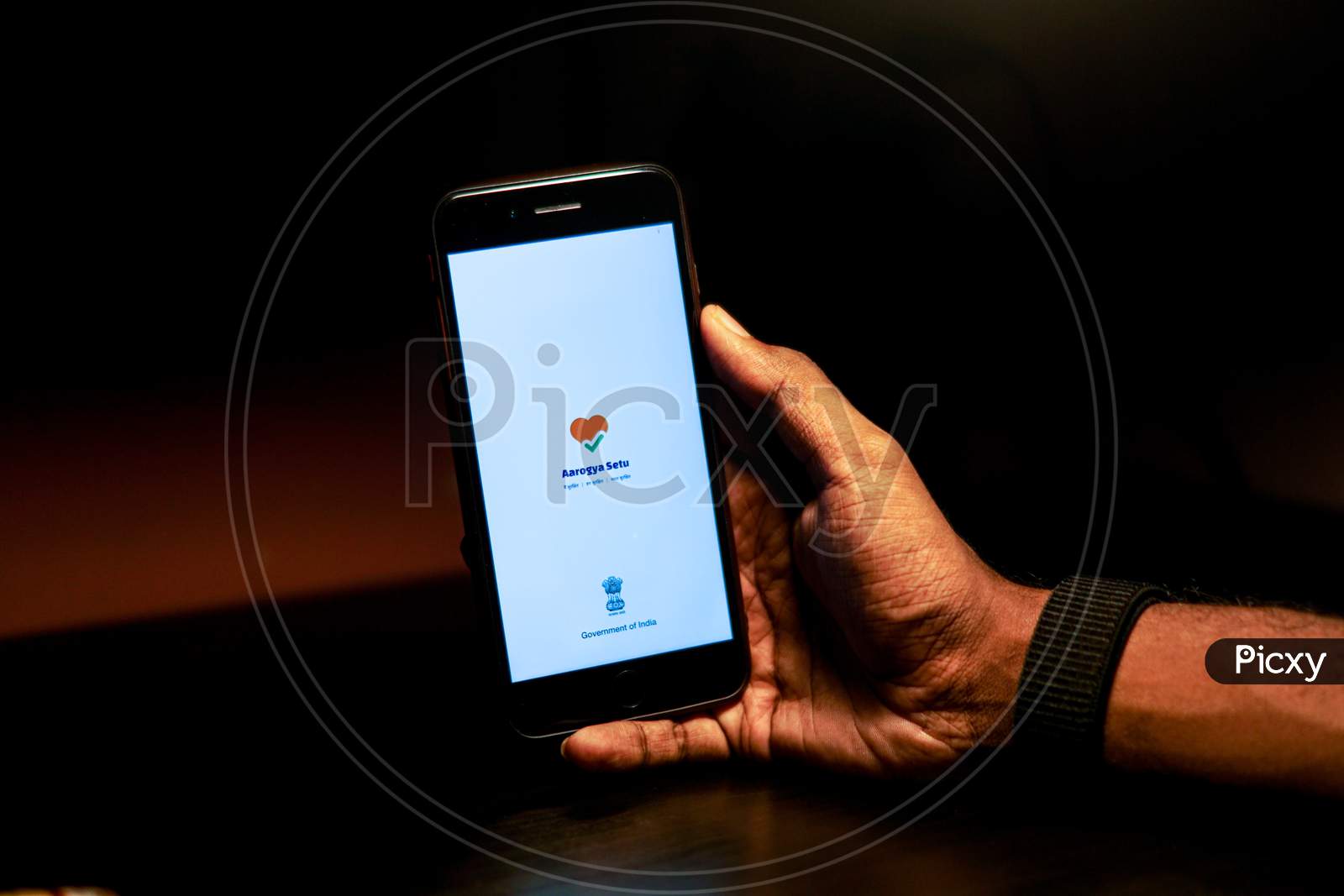 Aarogya Setu Mobile App Icon Opening on Smartphone Screen Closeup