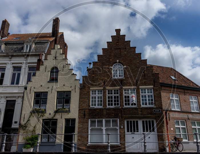 Brown And White Rooftop With Gable And Steps On The Houses At Brugge, Belgium, Europe