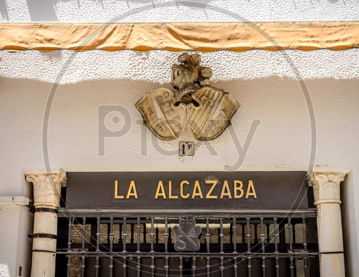 Seville, Spain- June 18, 2017 : A Statue Is Displayed At The Entrance Of The Alcazar Castle In Seville, Spain June 2017.