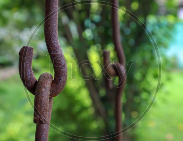 Rusted Iron Chains Holding Together. Swing Metal Chain Links Closeup.