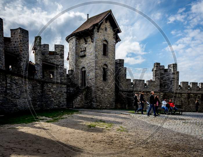 Ghent, Belgium - April 15 :  A Courtyard In The Gravensteen Castle In Ghent, Belgium. Tourists Walk Across The Coutryard