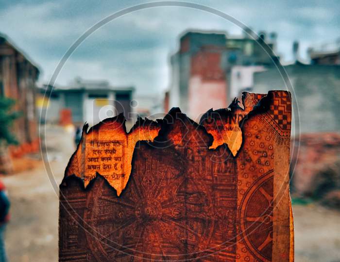 peice of a burning currency , art, creative photography