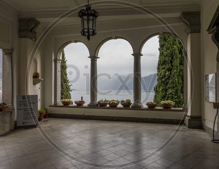 Varenna, Italy - March 31, 2018: The Entrance Arch Of Villa Monastero In Varenna, Italy
