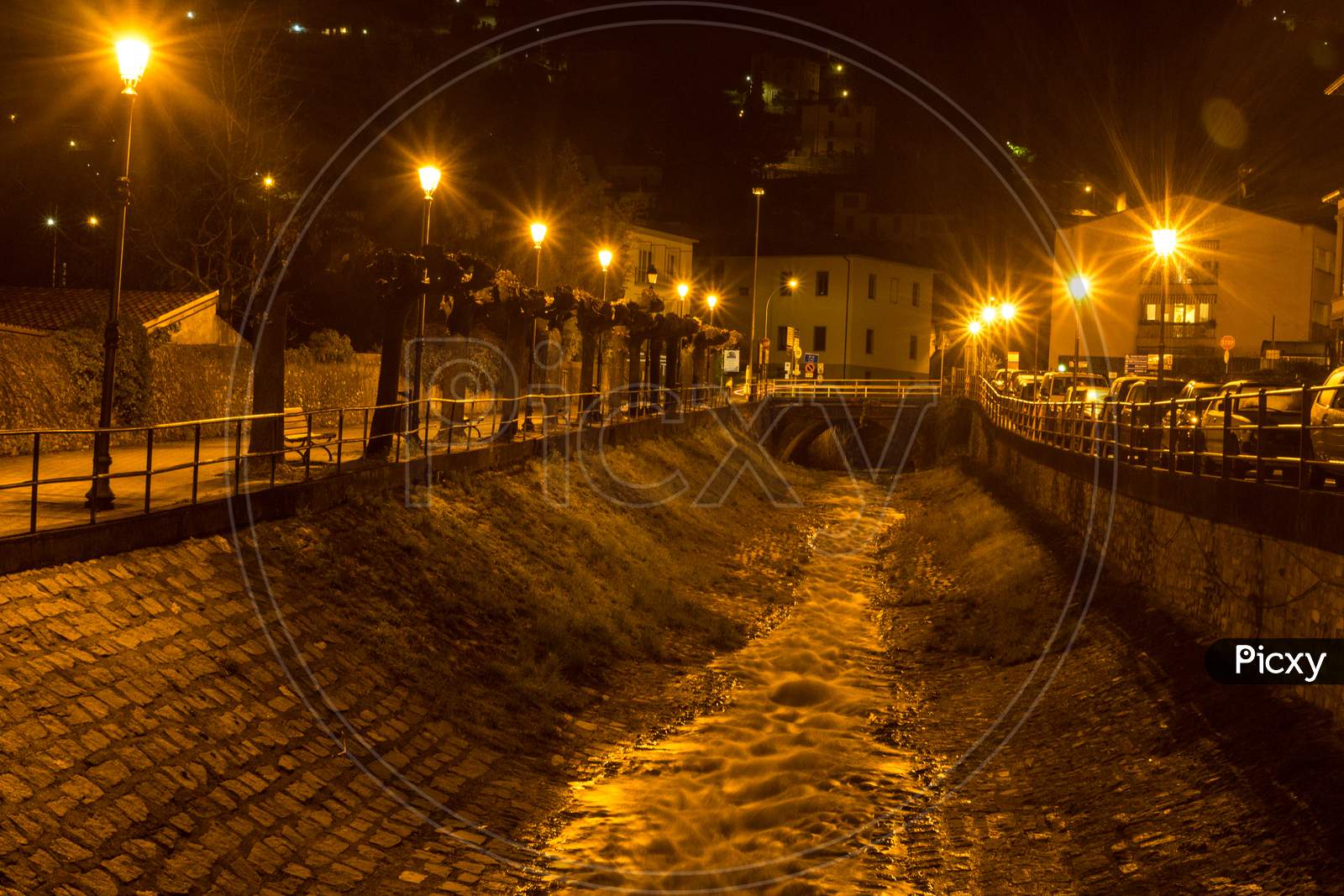 Italy, Varenna, Lake Como, A Stream Flowing Down A Path At Night
