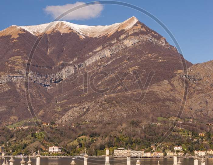 Bellagio, Italy-April 1, 2018: The Mansion At Villa Melzi With Mountain Background