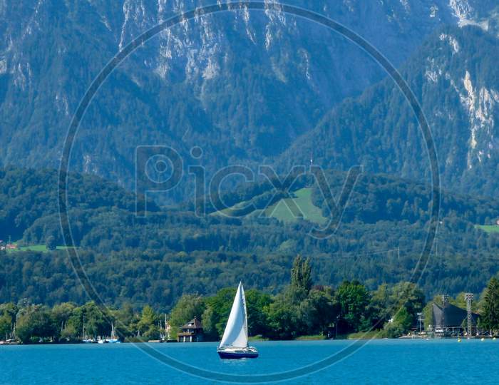 Switzerland, Lauterbrunnen, Sailboat Sailing On Sea Against Mountains