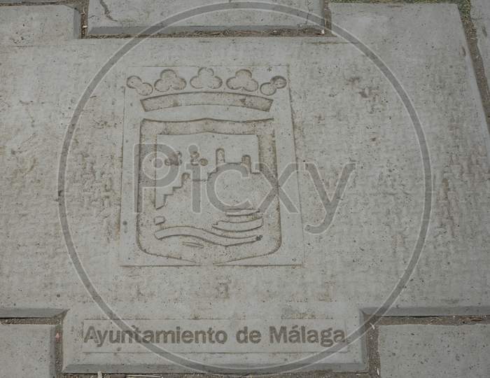 Spain, Malaga - 24 June 2017: A Stone Slab With The Words Ayuntamiento De Malaga At The Beach