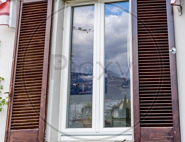 Italy, Varenna, Lake Como, Window With A Blinder On Top