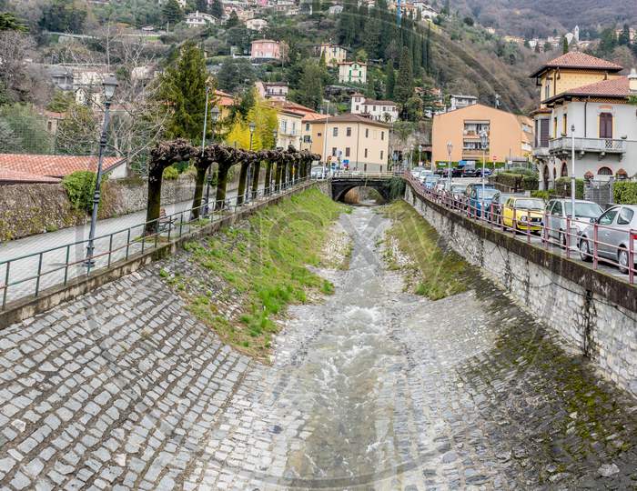 Italy, Varenna, Lake Como, A Stream Flowing Into The Mountain