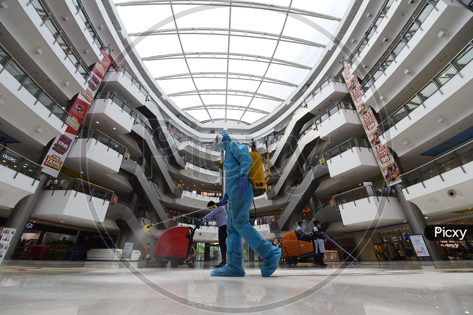 A Worker Sanitises The Floor Of A Shopping Mall Reopened After The Government Eased A Nationwide Lockdown Imposed As A Preventive Measure Against The Covid-19 Coronavirus, In Chennai On September 1, 2020.