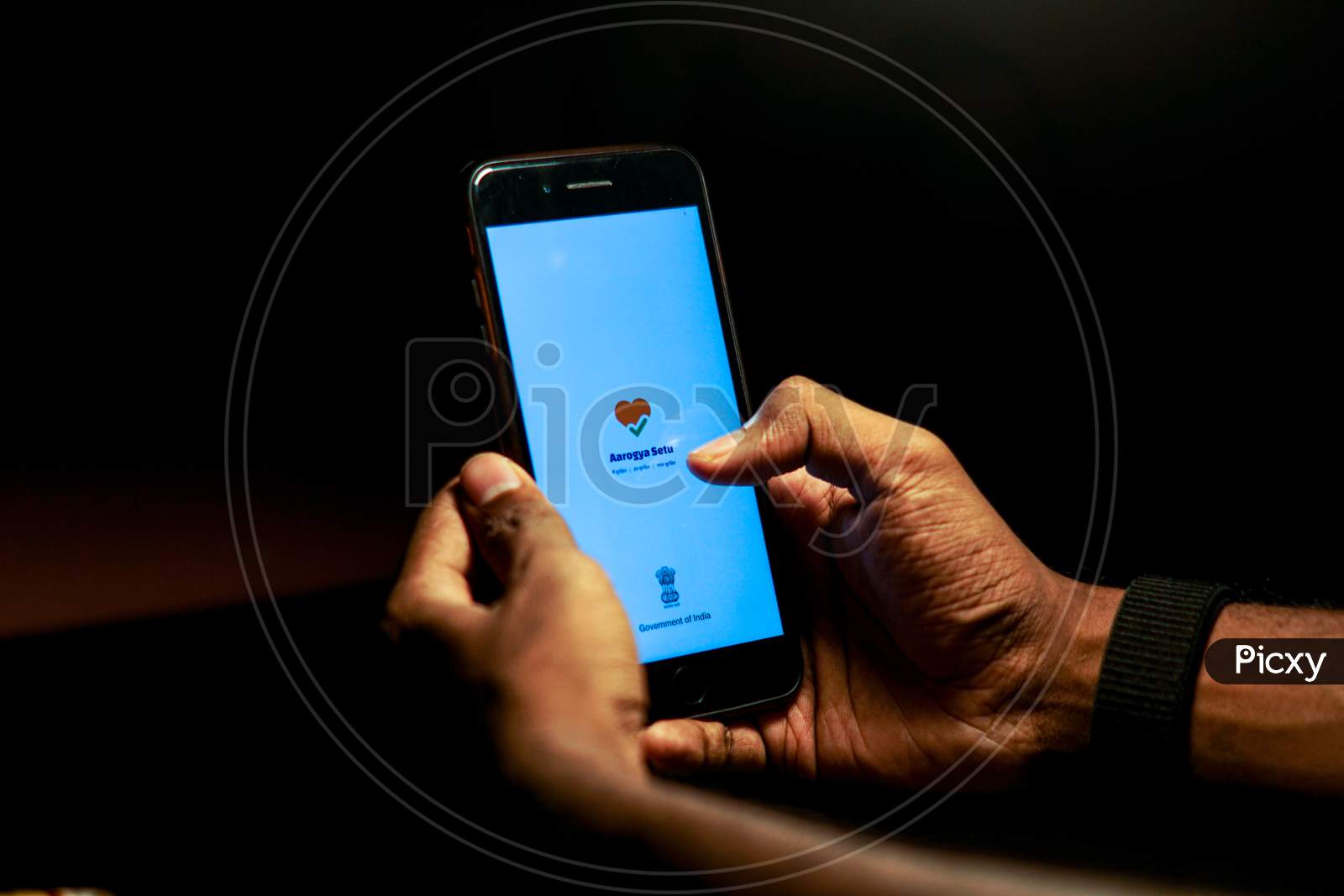 Aarogya Setu Mobile App Icon Opening on Smartphone Screen Closeup