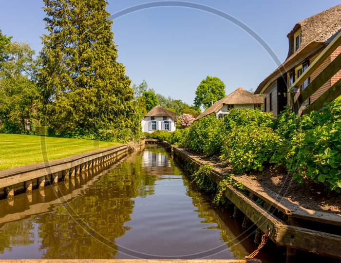 Netherlands, Giethoorn, A Canal In Front Of A House