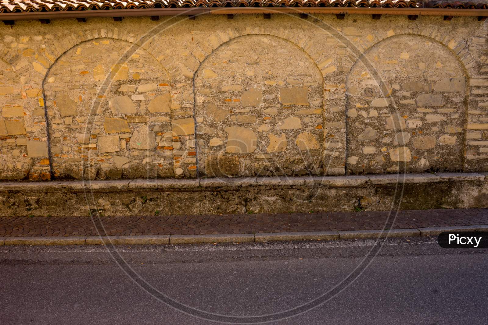 Italy, Menaggio, Lake Como, Stone Wall With Arch