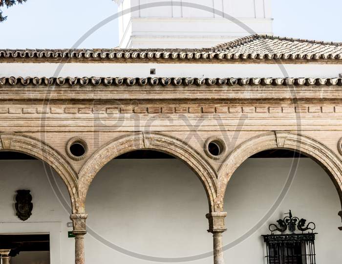 Seville, Spain- June 18, 2017: Masonic Stone Arches In The Courtyard Of The Alcazar Palace In Seville, Spain June 2017, Europe