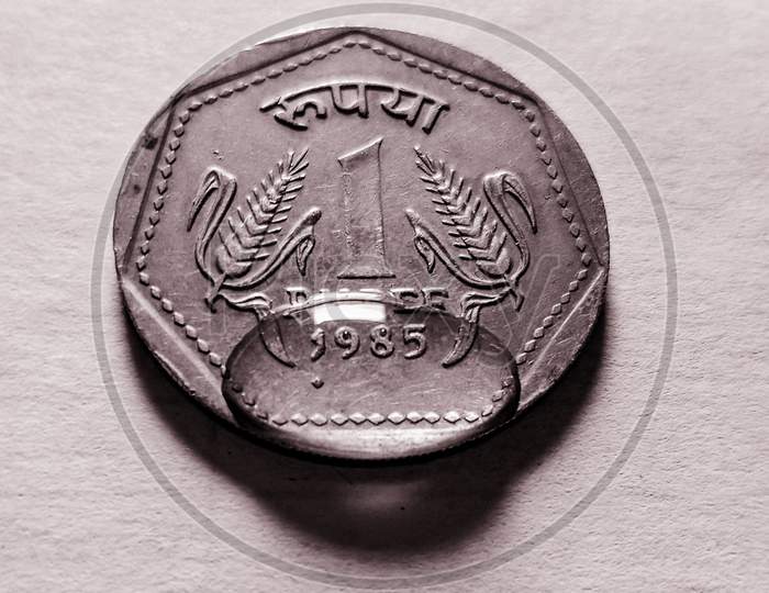 Water dropped on a one rupee coin