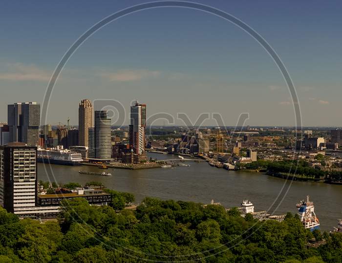 Netherlands, Rotterdam, The Cityscape And Skyline Of Rotterdam With Erasmus Bridge Panorama