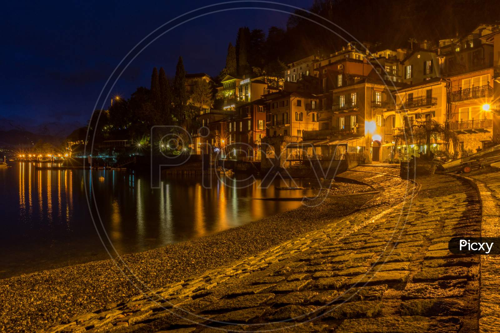 Italy, Varenna, Lake Como, Illuminated Fishing Village At Night