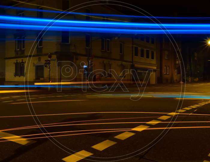 Light trails photo of a road crossing in Germany