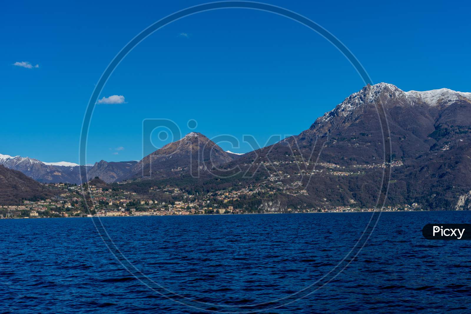 Italy, Bellagio, Lake Como With Snow Capped Alps Mountain
