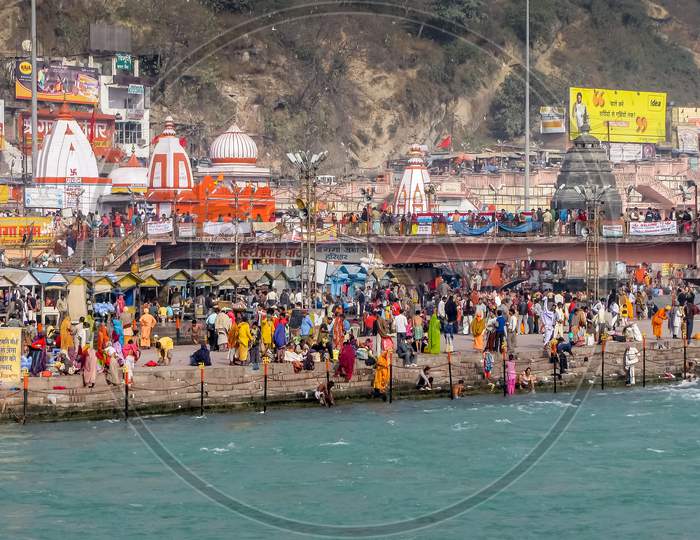 Crowd Taking Bath In Ganges & Performing Rituals At Ganga Ghat