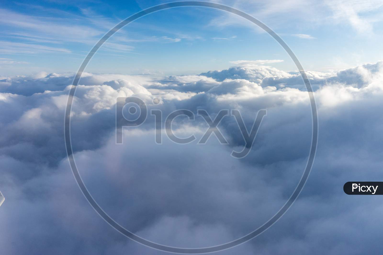 View From The Sky, Cloud, A Plane Flying Through A Cloudy Blue Sky