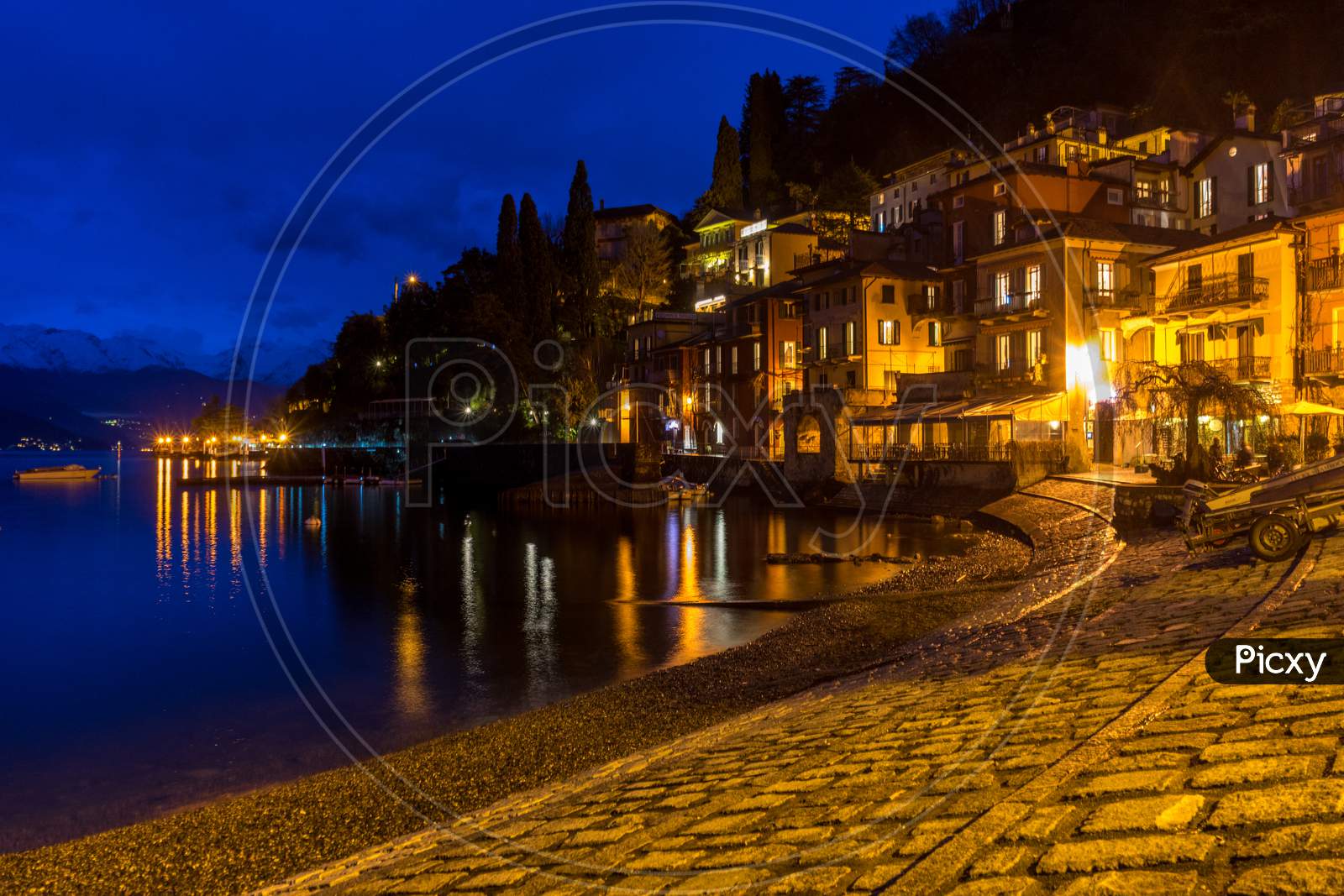 Italy, Varenna, Lake Como, Illuminated Fishing Village At Night