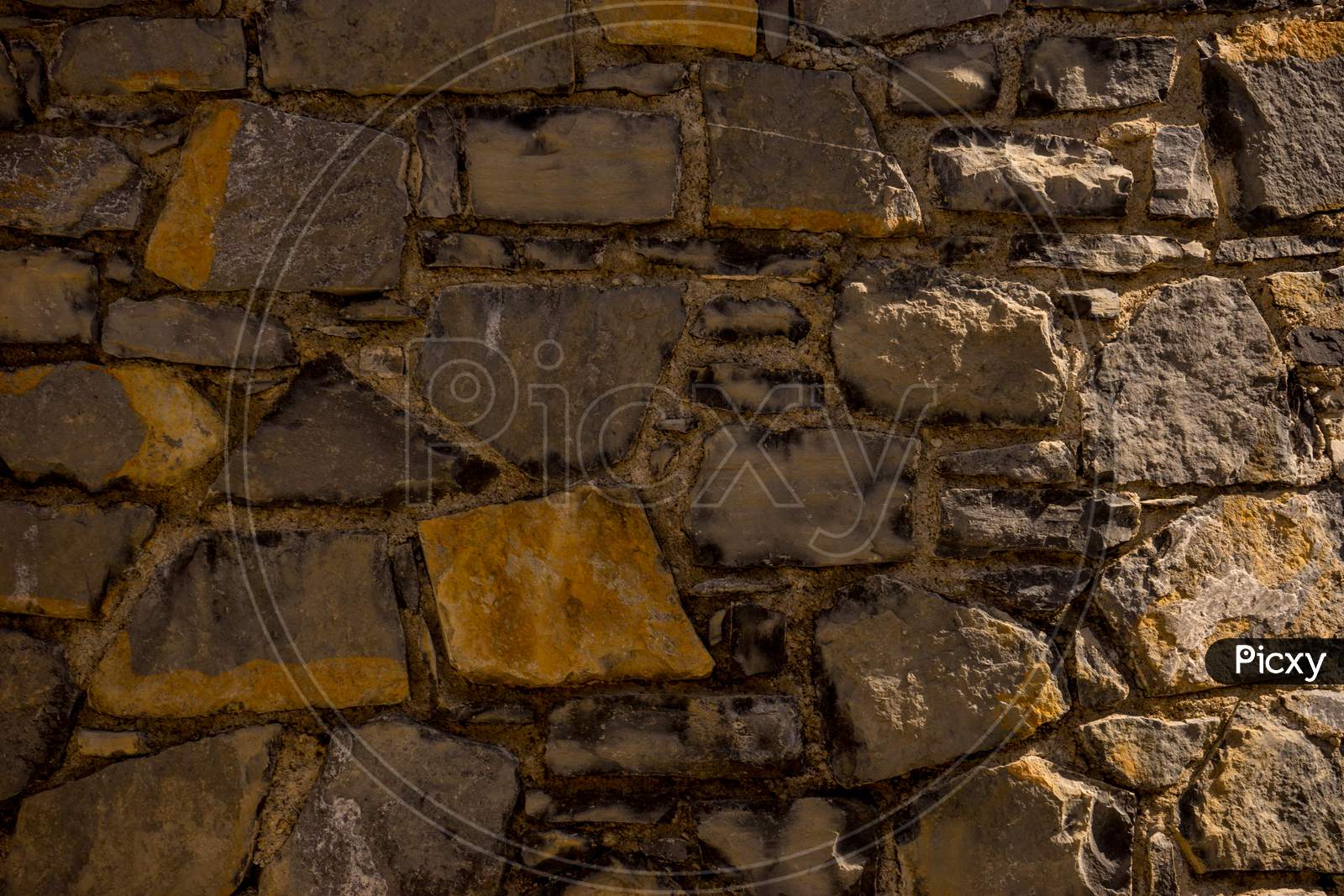 Italy, Menaggio, Lake Como, A Close Up Of A Brick Wall