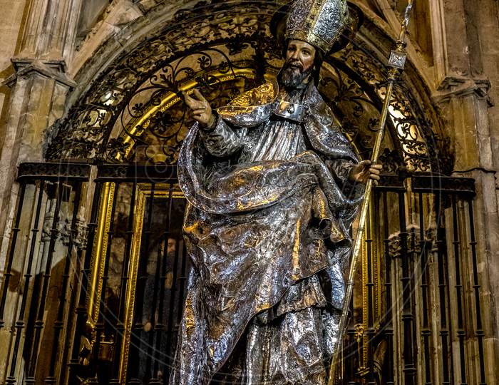 Seville, Spain- June 18, 2017: A Statue Of A Saint Inside The  Gothic Cathedral In Seville, Spain June 2017