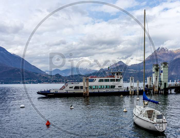 Varenna, Italy- March 31, 2018: A Spluga Boat On Lake Como Next To The Village Of Varenna